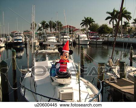 Stock Photography -  Bradenton, FL, Florida, Manatee River, Twin Dolphin Marina, yachts, Mickey Mouse Santa Claus. Fotosearch