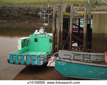 Stock Photo -  Canada, New Brunswick, Alma, Bay of Fundy, Highest tide in the world (48 feet), fishing boats. Fotosearch