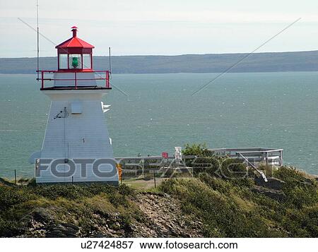 Stock Photo -  Canada, New Brunswick, Bay of Fundy, Cape Enrage, Cape Enrage Lightstation ca. 1840, lighthouse, cliff. Fotosearch