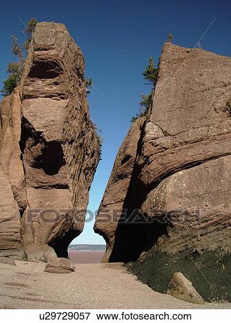 Stock Photo -  Canada, New Brunswick, Bay of Fundy, Hopewell Cape, Hopewell Rocks Ocean Tidal Exploration Site, Flower Pot Rocks. Fotosearch