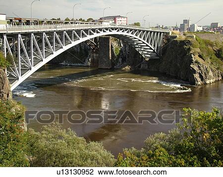 Canada, New Brunswick, Saint John, Bay of Fundy, Steel bridge spans Reversing Falls along the Bay of Fundy in St. John View Large Photo Image Stock Image -  Canada, New Brunswick, Saint John, Bay of Fundy, Steel bridge spans Reversing Falls along the Bay of Fundy in St. John. Fotosearch