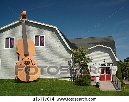 Canada, Prince Edward Island, Queens County, Cavendish, Giant fiddle displayed outside the Fiddlers & Followers Building at Rainbow Valley View Large Photo Image Picture - Canada, Prince Edward Island, Queens County, Cavendish, Giant fiddle displayed outside the Fiddlers & Followers Building at Rainbow Valley. Fotosearch