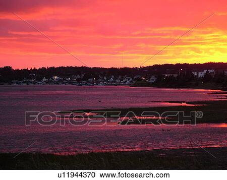 Stock Image -  Canada, Prince Edward Island, Queens County, Gulf of Saint Lawrence, North Rustico, sunset, fishing village, harbor . Fotosearch