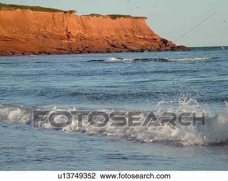 Stock Image -  Canada, Prince Edward Island, Queens County, Gulf of Saint Lawrence, Cavendish Beach, Prince Edward Island National Park, beach, surf, waves, shells. Fotosearch