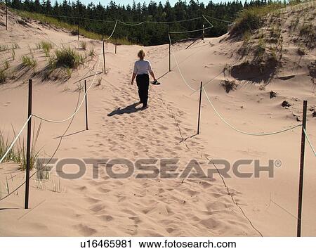 Canada, Prince Edward Island, Queens County, Gulf of Saint Lawrence, Cavendish Beach, Prince Edward Island National Park, woman walking on sand dunes, beach View Large Photo Image Stock Image -  Canada, Prince Edward Island, Queens County, Gulf of Saint Lawrence, Cavendish Beach, Prince Edward Island National Park, woman walking on sand dunes, beach. Fotosearch