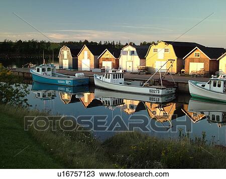 Stock Image -  Canada, Prince Edward Island, Queens County, Gulf of Saint Lawrence, New London, fishing village, harbor, fishing boats, marina, reflection. Fotosearch