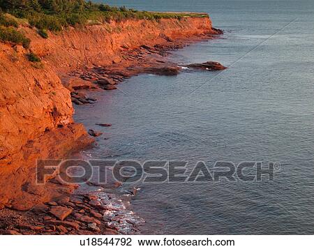 Stock Image -  Canada, Prince Edward Island, Queens County, Gulf of Saint Lawrence, Cavendish Beach, Prince Edward Island National Park, scenic coastline, early morning light. Fotosearch