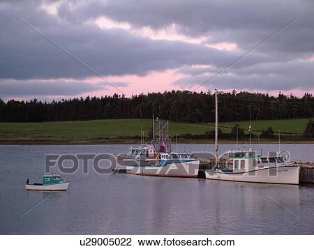 Stock Image -  Canada, Prince Edward Island, Queens County, Gulf of Saint Lawrence, North Rustico, evening, fishing village, harbor, fishing boats, marina. Fotosearch