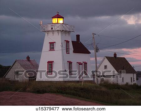 Stock Photo -  Canada, Prince Edward Island, Queens County, Gulf of Saint Lawrence, North Rustico, North Rustico Harbour Lighthouse, fishing village, harbor, evening. Fotosearch