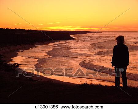 Canada, Prince Edward Island, Queens County, Gulf of Saint Lawrence, Cavendish Beach, Prince Edward Island National Park, scenic coastline, silhouette of woman at sunset View Large Photo Image Stock Photograph - Canada, Prince Edward Island, Queens County, Gulf of Saint Lawrence, Cavendish Beach, Prince Edward Island National Park, scenic coastline, silhouette of woman at sunset. Fotosearch