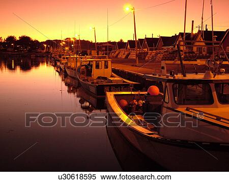 Stock Photography -  Canada, Prince Edward Island, Queens County, Gulf of Saint Lawrence, North Rustico, fishing village, harbor, fishing boats, marina, sunset. Fotosearch