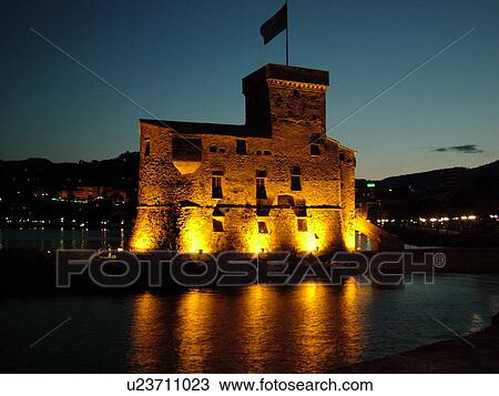 Stock Image -  castle, Italy, Liguria, Rapallo, Riviera di Levante, Ligurian Riviera, Europe, The Castle at night on the Gulf of Tigullio (Gulfo di Tigullo) in the resort town of Rapallo along the Ligurian Sea on the Ligurian Riviera.. Fotosearch