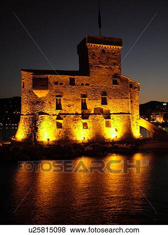castle, Liguria, Italy, Rapallo, Riviera di Levante, Ligurian Riviera, Europe, The Castle at night on the Gulf of Tigullio (Gulfo di Tigullo) in the resort town of Rapallo along the Ligurian Sea on the Ligurian Riviera. View Large Photo Image Stock Photo - castle, Liguria, Italy, Rapallo, Riviera di Levante, Ligurian Riviera, Europe, The Castle at night on the Gulf of Tigullio (Gulfo di Tigullo) in the resort town of Rapallo along the Ligurian Sea on the Ligurian Riviera.. Fotosearch