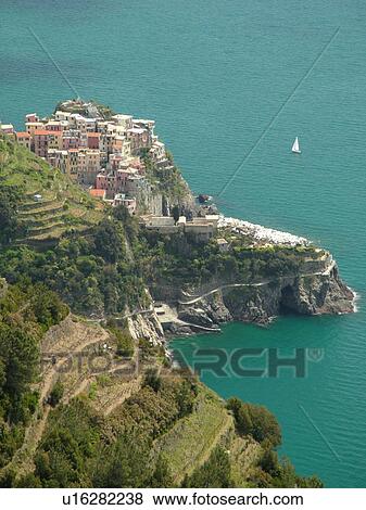 Cinque Terre, Liguria, Italy, Manarola, Riviera di Levante, Ligurian Riviera, Europe, Scenic view of Manarola, a Cinque Terre village, along the steep rocky coastline of the Ligurian Sea. View Large Photo Image Stock Photo - Cinque Terre, Liguria, Italy, Manarola, Riviera di Levante, Ligurian Riviera, Europe, Scenic view of Manarola, a Cinque Terre village, along the steep rocky coastline of the Ligurian Sea.. Fotosearch