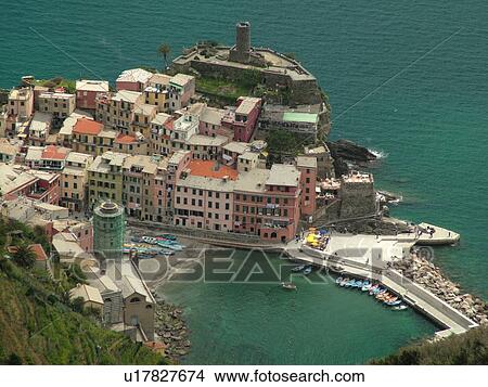Cinque Terre, Vernazza, Liguria, Italy, Riviera di Levante, Ligurian Riviera, Europe, Scenic view of Vernazza, a Cinque Terre village, along the steep rocky coast of the Ligurian Sea. View Large Photo Image Picture - Cinque Terre, Vernazza, Liguria, Italy, Riviera di Levante, Ligurian Riviera, Europe, Scenic view of Vernazza, a Cinque Terre village, along the steep rocky coast of the Ligurian Sea.. Fotosearch