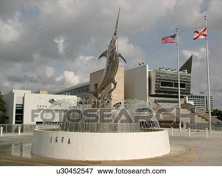 Stock Photo -  Dania Beach, Fort Lauderdale, FL, Florida, International Game Fishing Association, I. G. F. A. Fishing Hall of Fame and Museum, stainless steel statue of Sword Dance, fountain. Fotosearch