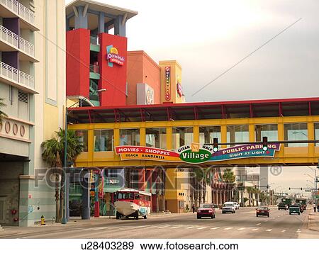 Stock Photo -  Daytona Beach, FL, Florida, Ocean Walk Village, pedestrian bridge crosses over the main street. Fotosearch
