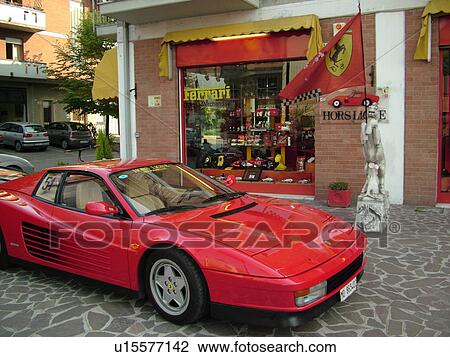 Ferrari, Italy, Emilia-Romagna, Maranello, Europe, Red Ferrari parked outside a Ferrari shop in the town of Maranello. View Large Photo Image Stock Image - Ferrari, Italy, Emilia-Romagna, Maranello, Europe, Red Ferrari parked outside a Ferrari shop in the town of Maranello.. Fotosearch