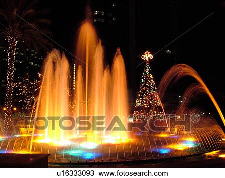 Stock Image -  Fort Lauderdale, FL, Florida, downtown, Bubier Park, Musical Fountain, illuminated, evening. Fotosearch