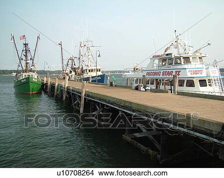 Greenport, NY, Long Island, New York, Atlantic Ocean, Boats docked a pier at the North Ferry Terminal View Large Photo Image Picture - Greenport, NY, Long Island, New York, Atlantic Ocean, Boats docked a pier at the North Ferry Terminal. Fotosearch