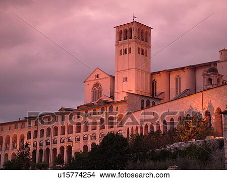 Italy, Assisi, Umbria, Europe, Basilica di San Francesco (Basilica of St. Francis of Assisi) and the Sacro Convento illuminated at night on the slopes of Monte Subasio in the medieval hill town of Assisi. View Large Photo Image Picture - Italy, Assisi, Umbria, Europe, Basilica di San Francesco (Basilica of St. Francis of Assisi) and the Sacro Convento illuminated at night on the slopes of Monte Subasio in the medieval hill town of Assisi.. Fotosearch
