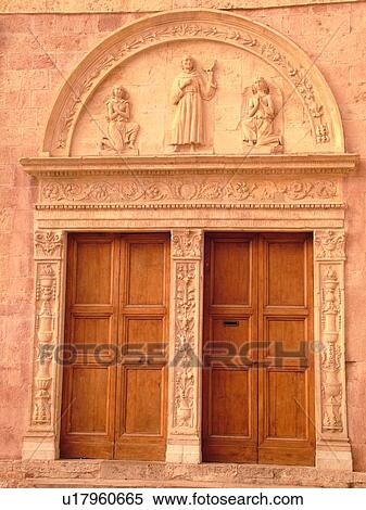 Stock Photography -  Italy, Assisi, Umbria, Europe, Relief carving on the fatade of the Basilica di San Francesco (Basilica of St. Francis of Assisi) and the Sacro Convento in the medieval hill town of Assisi.. Fotosearch