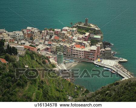 Italy, Cinque Terre, Vernazza, Liguria, Riviera di Levante, Ligurian Riviera, Europe, Scenic view of Vernazza, a Cinque Terre village, along the steep rocky coast of the Ligurian Sea. View Large Photo Image Stock Photo - Italy, Cinque Terre, Vernazza, Liguria, Riviera di Levante, Ligurian Riviera, Europe, Scenic view of Vernazza, a Cinque Terre village, along the steep rocky coast of the Ligurian Sea.. Fotosearch