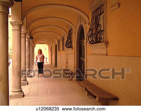 Stock Photography -  Italy, Poppi, Tuscany, Toscana, Europe, Arcades line the main street of downtown Poppi in the Casentino hill region.. Fotosearch
