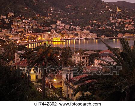 Italy, Rapallo, Riviera di Levante, Liguria, Ligurian Riviera, Europe, Scenic view of the resort town of Rapallo in the evening on the Gulf of Tigullio (Gulfo di Tigullio) along the Ligurian Sea on the Ligurian Riviera. View Large Photo Image Stock Image - Italy, Rapallo, Riviera di Levante, Liguria, Ligurian Riviera, Europe, Scenic view of the resort town of Rapallo in the evening on the Gulf of Tigullio (Gulfo di Tigullio) along the Ligurian Sea on the Ligurian Riviera.. Fotosearch