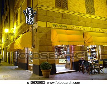Italy, Rapallo, Riviera di Levante, Liguria, Ligurian Riviera, Europe, Outdoor cafT and shops along a narrow street in the resort town of Rapallo in the evening. View Large Photo Image Stock Image - Italy, Rapallo, Riviera di Levante, Liguria, Ligurian Riviera, Europe, Outdoor cafT and shops along a narrow street in the resort town of Rapallo in the evening.. Fotosearch
