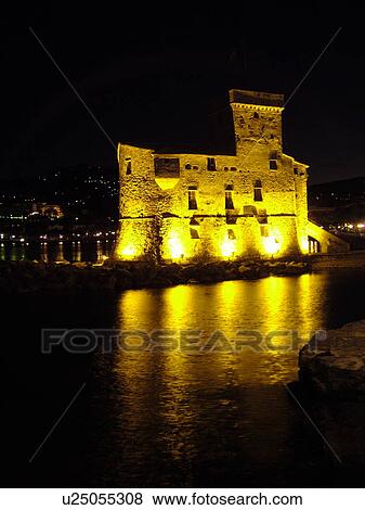 Italy, Rapallo, Riviera di Levante, Liguria, Ligurian Riviera, Europe, The Castle at night on the Gulf of Tigullio (Gulfo di Tigullo) in the resort town of Rapallo along the Ligurian Sea on the Ligurian Riviera. View Large Photo Image Stock Photo - Italy, Rapallo, Riviera di Levante, Liguria, Ligurian Riviera, Europe, The Castle at night on the Gulf of Tigullio (Gulfo di Tigullo) in the resort town of Rapallo along the Ligurian Sea on the Ligurian Riviera.. Fotosearch