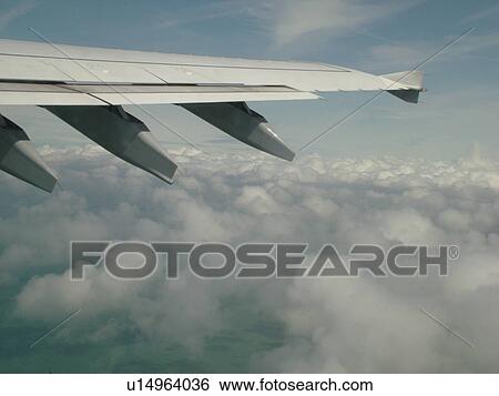 Italy, Rome, Lazio, Roma, Europe, Wing of airplane over clouds. View Large Photo Image Stock Photograph - Italy, Rome, Lazio, Roma, Europe, Wing of airplane over clouds.. Fotosearch
