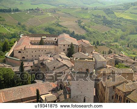 Italy, San Gimignano, Toscana, Tuscany, Europe, Aerial view of the rooftops and medieval town of San Gimignano from Torre Grossa. View Large Photo Image Stock Photography - Italy, San Gimignano, Toscana, Tuscany, Europe, Aerial view of the rooftops and medieval town of San Gimignano from Torre Grossa.. Fotosearch
