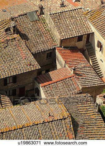 Italy, San Gimignano, Tuscany, Toscana, Europe, Aerial view of the rooftops and medieval town of San Gimignano from Torre Grossa. View Large Photo Image Stock Image - Italy, San Gimignano, Tuscany, Toscana, Europe, Aerial view of the rooftops and medieval town of San Gimignano from Torre Grossa.. Fotosearch