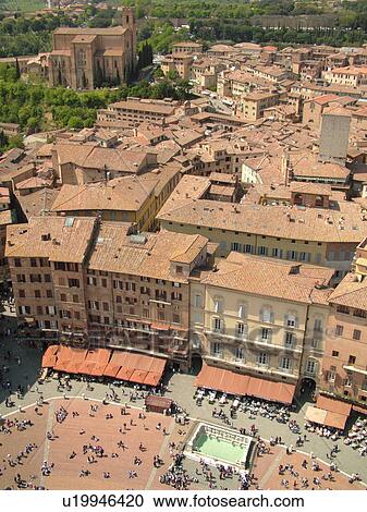 Stock Image -  Italy, Siena, Tuscany, Toscana, Europe, Aerial view of the Piazza del Campo and the city of Siena from Torre del Mangia.. Fotosearch