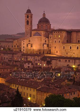 Stock Photo -  Italy, Urbino, Marche, Europe, The Palazzo Ducale in the medieval hill town of Urbino in the evening.. Fotosearch