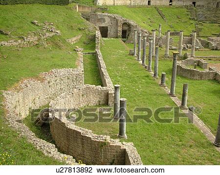 Stock Image -  Italy, Volterra, Toscana, Tuscany, Europe, The ancient ruins of Teatro Romano (Roman Theater) in the medieval town of Volterra.. Fotosearch