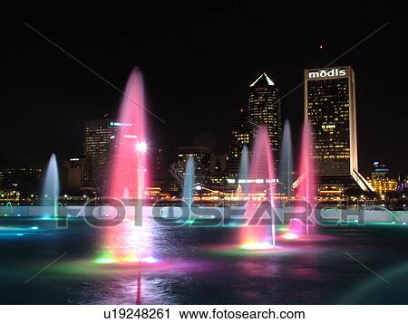 Stock Image -  Jacksonville, FL, Florida, downtown skyline, Friendship Fountain at Friendship Park illuminated at night. Fotosearch