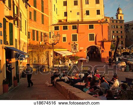 Stock Photograph -  Liguria, Italy, Camogli, Riviera di Levante, Ligurian Riviera, Europe, Fishing boats along the waterfront of the fishing port in the resort town of Camogli along the Ligurian Sea.. Fotosearch