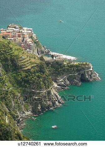 Liguria, Italy, Cinque Terre, Manarola, Riviera di Levante, Ligurian Riviera, Europe, Scenic view of Manarola, a Cinque Terre village, along the steep rocky coastline of the Ligurian Sea. View Large Photo Image Stock Image - Liguria, Italy, Cinque Terre, Manarola, Riviera di Levante, Ligurian Riviera, Europe, Scenic view of Manarola, a Cinque Terre village, along the steep rocky coastline of the Ligurian Sea.. Fotosearch