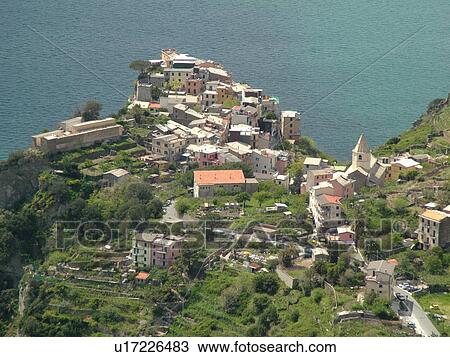 Liguria, Italy, Cinque Terre, Corniglia, Riviera di Levante, Ligurian Riviera, Europe, Scenic view of Corniglia, a Cinque Terre village, along the Ligurian Sea. View Large Photo Image Stock Image - Liguria, Italy, Cinque Terre, Corniglia, Riviera di Levante, Ligurian Riviera, Europe, Scenic view of Corniglia, a Cinque Terre village, along the Ligurian Sea.. Fotosearch