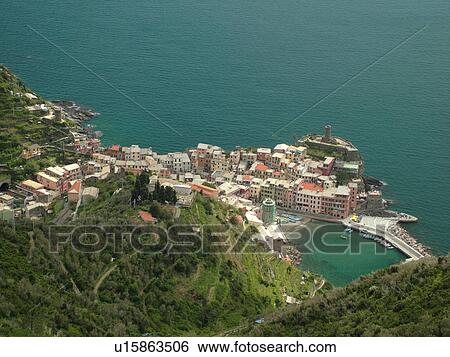 Liguria, Italy, Cinque Terre, Vernazza, Riviera di Levante, Ligurian Riviera, Europe, Scenic view of Vernazza, a Cinque Terre village, along the steep rocky coast of the Ligurian Sea. View Large Photo Image Stock Photograph - Liguria, Italy, Cinque Terre, Vernazza, Riviera di Levante, Ligurian Riviera, Europe, Scenic view of Vernazza, a Cinque Terre village, along the steep rocky coast of the Ligurian Sea.. Fotosearch