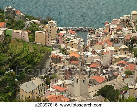 Liguria, Italy, Cinque Terre, Riomaggiore, Riviera di Levante, Ligurian Riviera, Europe, Riomaggiore, a Cinque Terre village, along the Ligurian Sea. View Large Photo Image Stock Photograph - Liguria, Italy, Cinque Terre, Riomaggiore, Riviera di Levante, Ligurian Riviera, Europe, Riomaggiore, a Cinque Terre village, along the Ligurian Sea.. Fotosearch