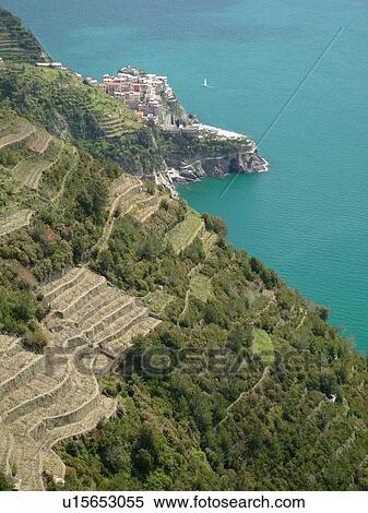 Stock Photography -  Liguria, Italy, Cinque Terre, Manarola, Riviera di Levante, Ligurian Riviera, Europe, Scenic view of Manarola, a Cinque Terre village, along the steep rocky coastline of the Ligurian Sea.. Fotosearch