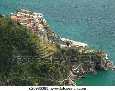 Liguria, Italy, Cinque Terre, Manarola, Riviera di Levante, Ligurian Riviera, Europe, Scenic view of Manarola, a Cinque Terre village, along the steep rocky coastline of the Ligurian Sea. View Large Photo Image Stock Photography - Liguria, Italy, Cinque Terre, Manarola, Riviera di Levante, Ligurian Riviera, Europe, Scenic view of Manarola, a Cinque Terre village, along the steep rocky coastline of the Ligurian Sea.. Fotosearch