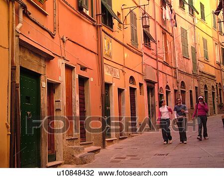 Liguria, Italy, Portovenere, Riviera di Levante, Ligurian Riviera, Europe, Buildings along a narrow street in the resort town of Portovenere along the Ligurian Sea. View Large Photo Image Stock Image - Liguria, Italy, Portovenere, Riviera di Levante, Ligurian Riviera, Europe, Buildings along a narrow street in the resort town of Portovenere along the Ligurian Sea.. Fotosearch
