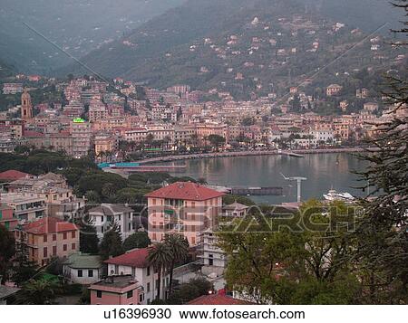 Liguria, Italy, Rapallo, Riviera di Levante, Ligurian Riviera, Europe, Scenic view of the resort town of Rapallo in the evening on the Gulf of Tigullio (Gulfo di Tigullio) along the Ligurian Sea on the Ligurian Riviera. View Large Photo Image Stock Image - Liguria, Italy, Rapallo, Riviera di Levante, Ligurian Riviera, Europe, Scenic view of the resort town of Rapallo in the evening on the Gulf of Tigullio (Gulfo di Tigullio) along the Ligurian Sea on the Ligurian Riviera.. Fotosearch