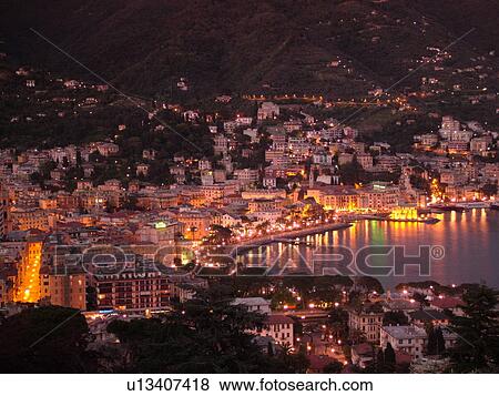 Liguria, Italy, Rapallo, Riviera di Levante, Ligurian Riviera, Europe, Scenic view of the resort town of Rapallo in the evening on the Gulf of Tigullio (Gulfo di Tigullio) along the Ligurian Sea on the Ligurian Riviera. View Large Photo Image Stock Photo - Liguria, Italy, Rapallo, Riviera di Levante, Ligurian Riviera, Europe, Scenic view of the resort town of Rapallo in the evening on the Gulf of Tigullio (Gulfo di Tigullio) along the Ligurian Sea on the Ligurian Riviera.. Fotosearch