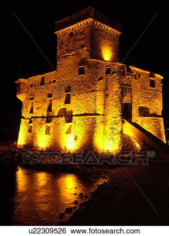 Liguria, Italy, Rapallo, Riviera di Levante, Ligurian Riviera, Europe, The Castle at night on the Gulf of Tigullio (Gulfo di Tigullo) in the resort town of Rapallo along the Ligurian Sea on the Ligurian Riviera. View Large Photo Image Stock Photograph - Liguria, Italy, Rapallo, Riviera di Levante, Ligurian Riviera, Europe, The Castle at night on the Gulf of Tigullio (Gulfo di Tigullo) in the resort town of Rapallo along the Ligurian Sea on the Ligurian Riviera.. Fotosearch