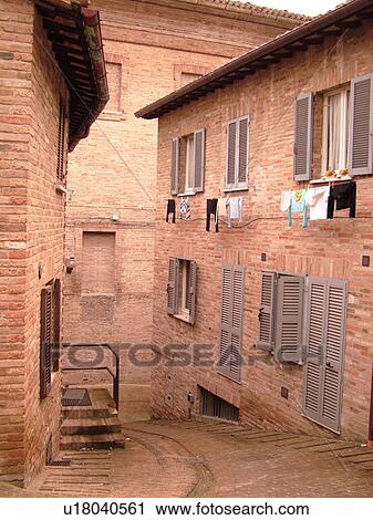 Marche, Italy, Urbino, Europe, Laundry hanging from a building along a narrow street in the medieval town of Urbino. View Large Photo Image Stock Image - Marche, Italy, Urbino, Europe, Laundry hanging from a building along a narrow street in the medieval town of Urbino.. Fotosearch